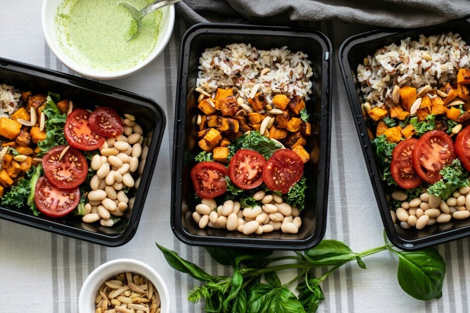 Vegan ready meal trays with beans, wild rice, and vegetables – perfect for plant-based convenience food in the UK